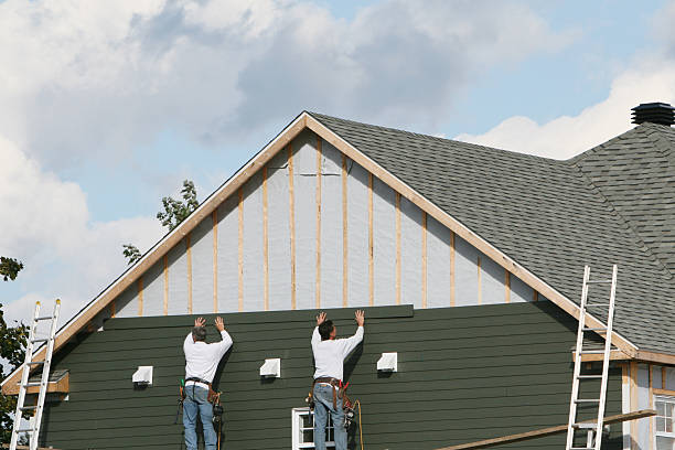 Professional Vinyl Siding technician working in Ridge, NY